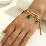gold bracelet with black clover charms Pakistan
